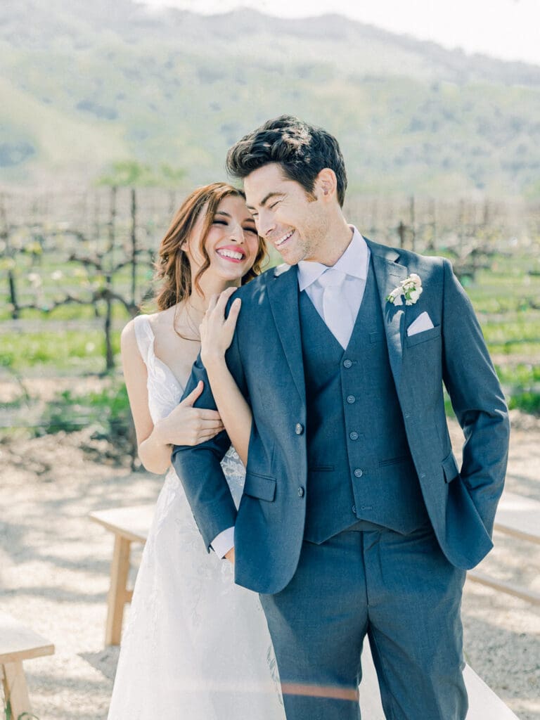 Bride and Groom laughing at  Intimate Vineyard Wedding at Sunstone Winery