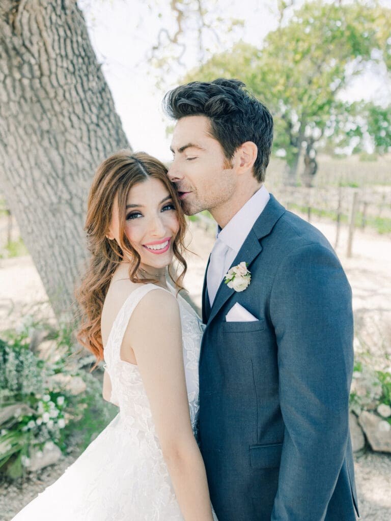 Bride and Groom laughing at  Intimate Vineyard Wedding at Sunstone Winery