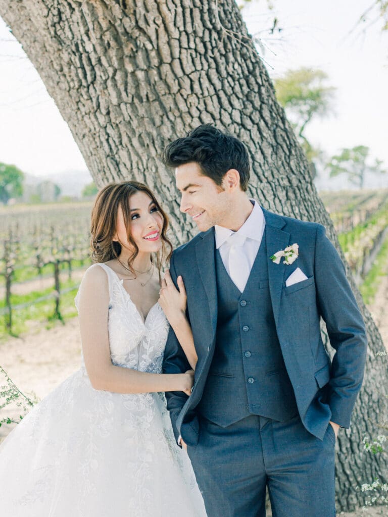 Bride and Groom looking at each other at Intimate Vineyard Wedding at Sunstone Winery