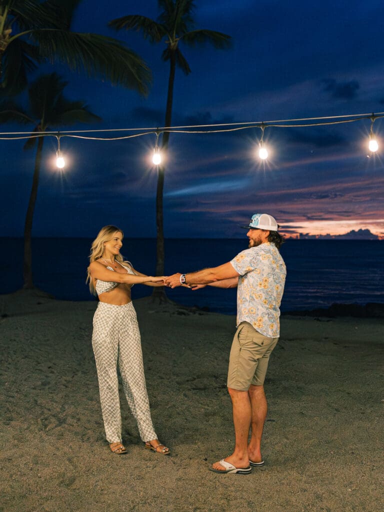 dances after the sunset in Hawaii Big Island Engagement Session 