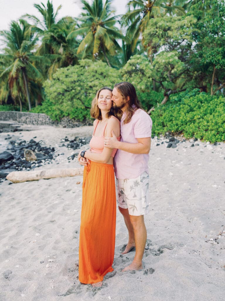 Romantic and intimate Couples Engagement Photo on the tropical Big Island of Hawaii beach by Hawaii film wedding photographer