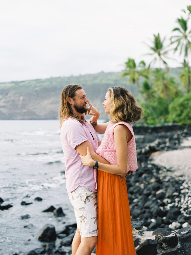 Romantic and intimate Couples Engagement Photo on the Big Island of Hawaii beach by Hawaii film wedding photographer