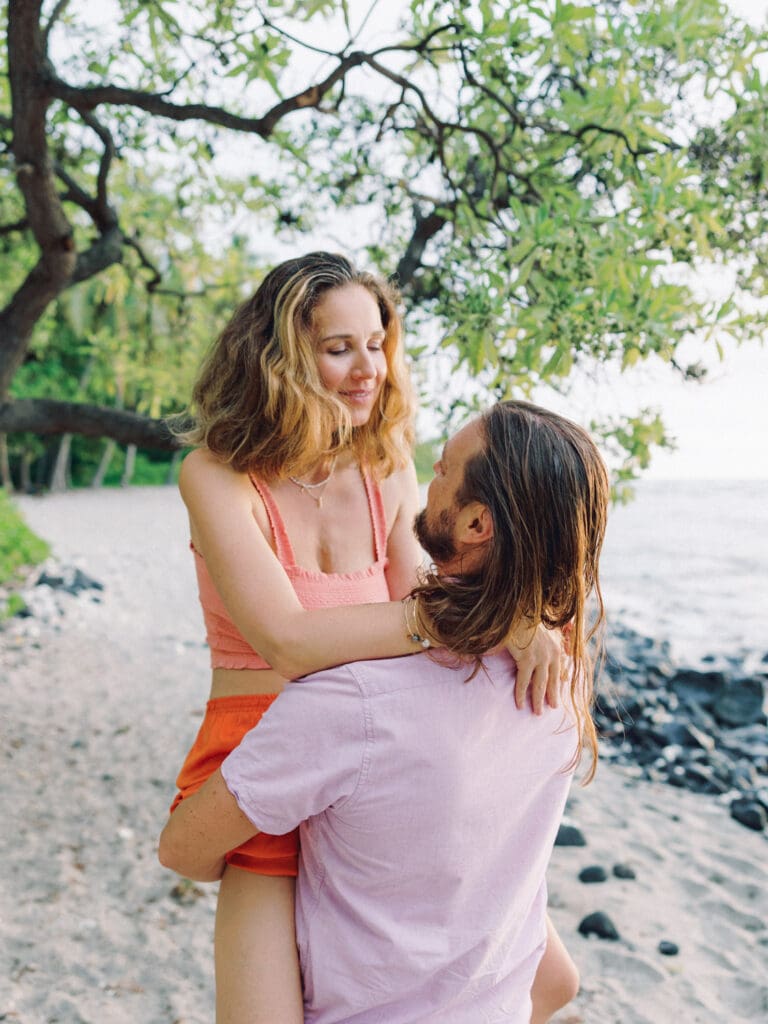 Romantic and intimate Couples Engagement Photo on the Big Island of Hawaii beach by Hawaii wedding photographer