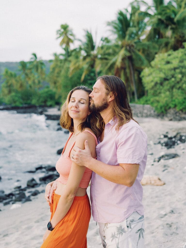 Romantic and intimate Couples Engagement Photo on the tropical Big Island of Hawaii beach by Hawaii film wedding photographer