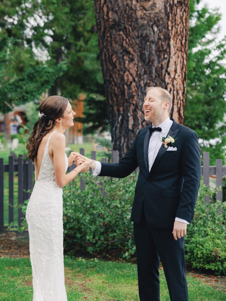 Elegant bride and groom first look portraits on the beach at Edgewood Tahoe Resort wedding, highlighting the stunning backdrop of Lake Tahoe.