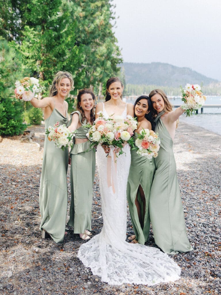 Bridesmaids on the beach at Edgewood Tahoe Resort wedding, highlighting the stunning backdrop of Lake Tahoe.