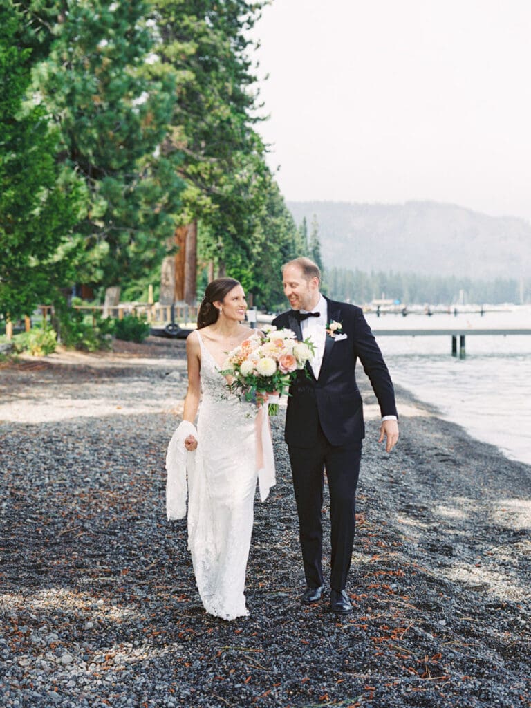 Elegant bride and groom first look portraits on the beach at Edgewood Tahoe Resort wedding, highlighting the stunning backdrop of Lake Tahoe.