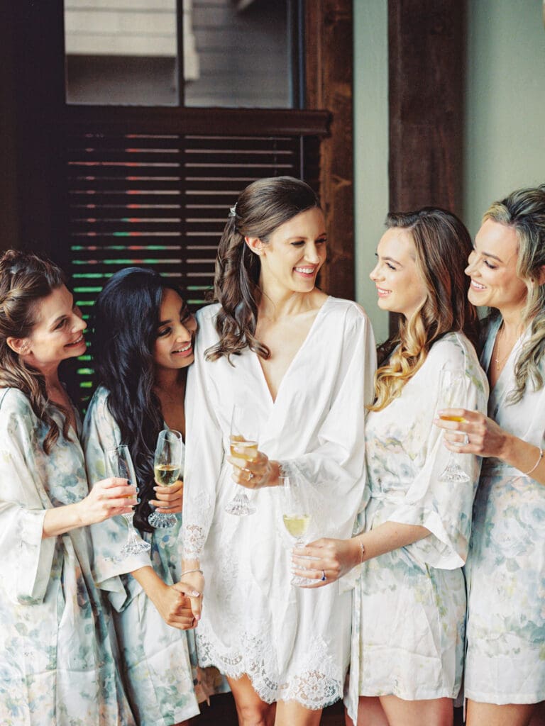 Elegant bride and bridesmaids getting ready portraits at Edgewood Tahoe Resort wedding, highlighting the stunning backdrop of Lake Tahoe.