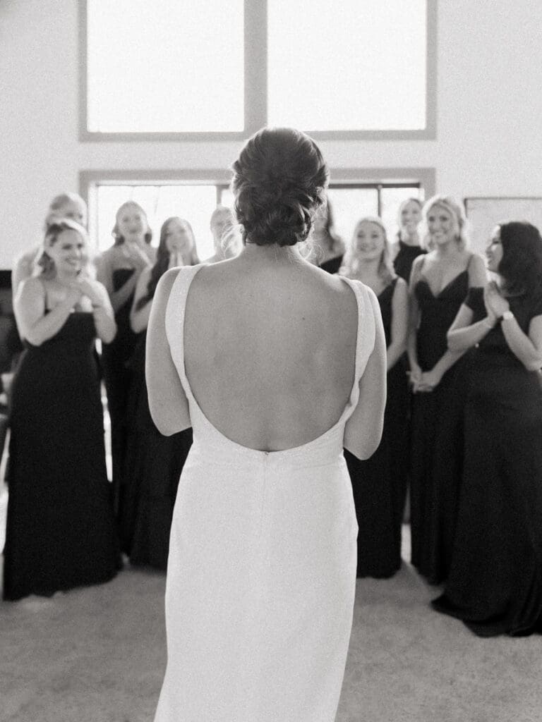 A touching scene of bride dress reveal moment whilst getting ready for Gar Woods Lake Tahoe wedding.