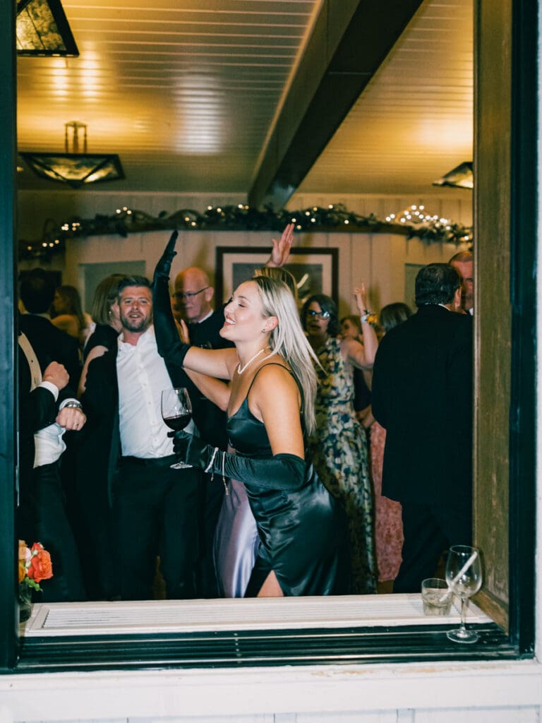 Guests pose for a photo during cocktail hour at Gar Woods Lake Tahoe Wedding