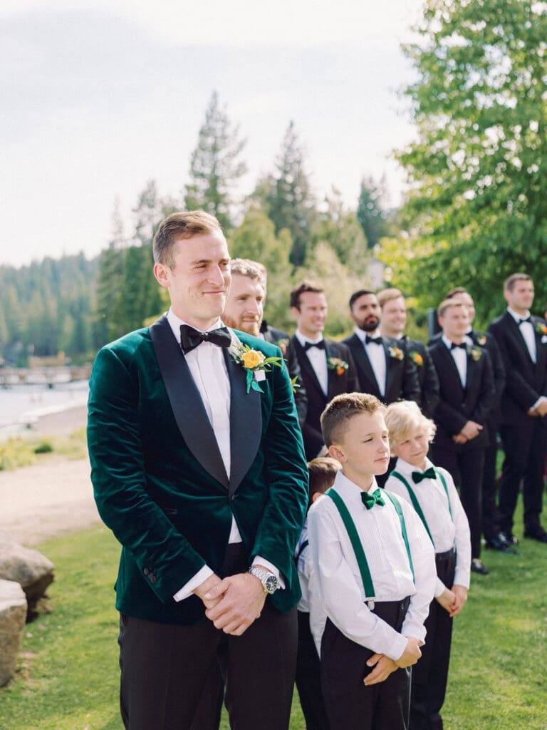 A serene beach wedding ceremony at Gar Woods, Lake Tahoe, showcasing the couple amidst a stunning lakeside setting.