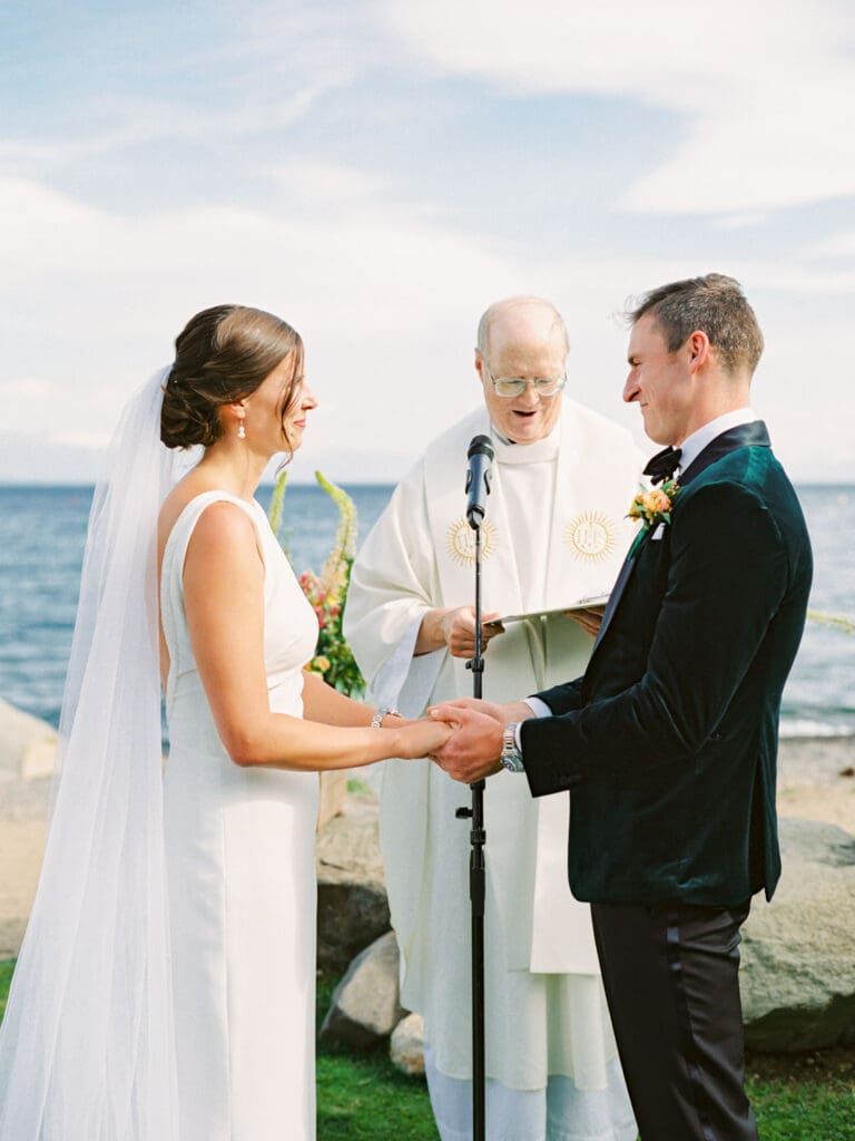 A serene beach wedding ceremony at Gar Woods, Lake Tahoe, showcasing the couple amidst a stunning lakeside setting.