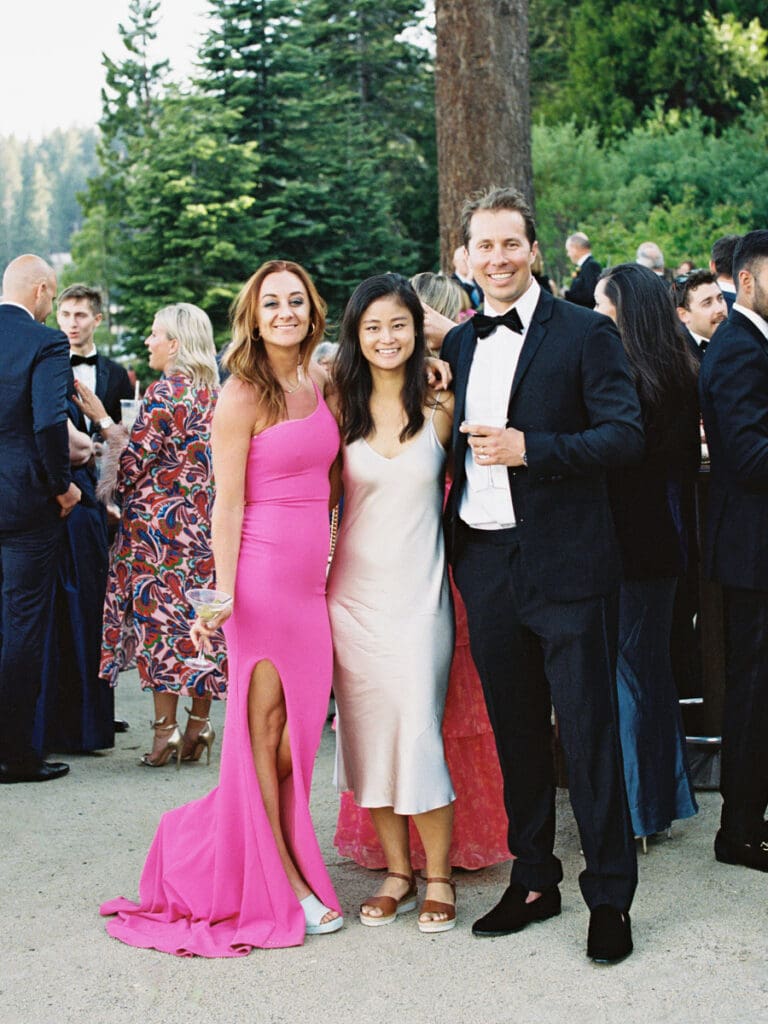 Guests pose for a photo during cocktail hour at Gar Woods Lake Tahoe Wedding