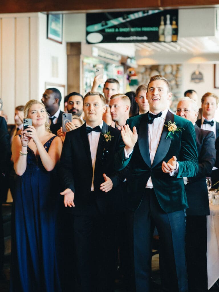 A bride and groom share their first dance at their wedding reception at Gar Woods, Lake Tahoe, surrounded by love and joy.