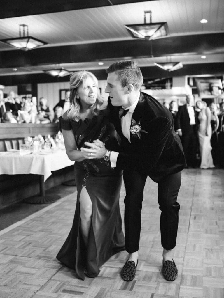 A bride and groom share their first dance at their wedding reception at Gar Woods, Lake Tahoe, surrounded by love and joy.