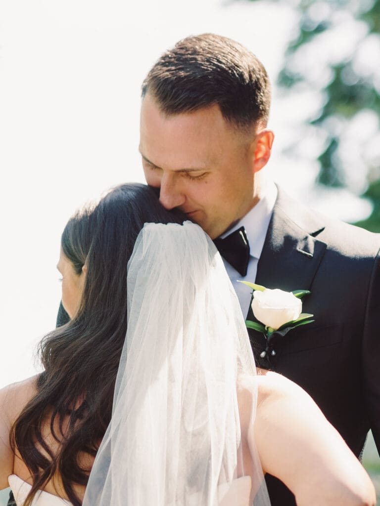 A wedding photographer captures stunning bride and groom portraits at Gar Woods, Lake Tahoe, showcasing love and elegance.