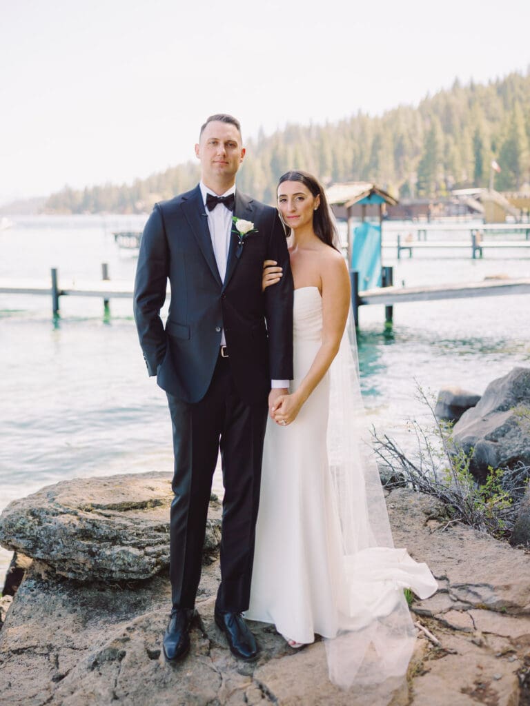 A wedding photographer captures stunning bride and groom portraits at Gar Woods, Lake Tahoe, showcasing love and elegance.