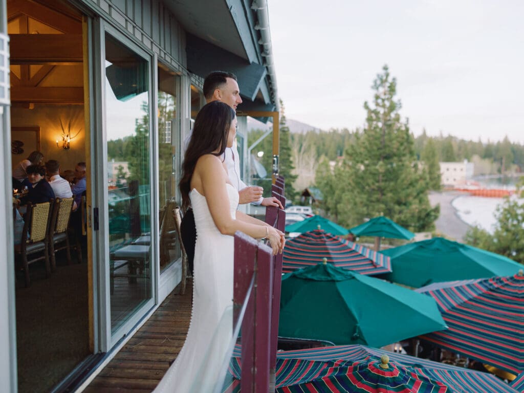 Bride and Groom on the balcony in Gar Woods Grill & Pier celebrating their wedding day 