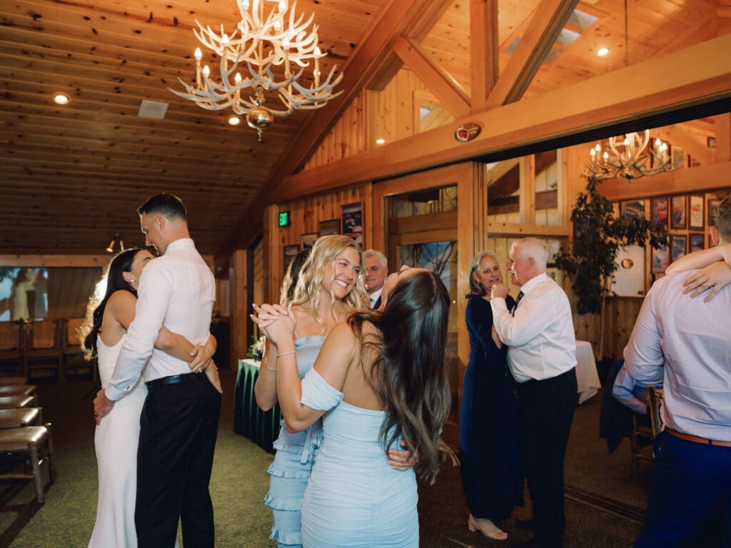 Reception dances at Gar Woods Lake Tahoe wedding 