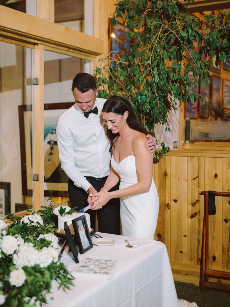 Cake cutting at Gar Woods Lake Tahoe wedding 