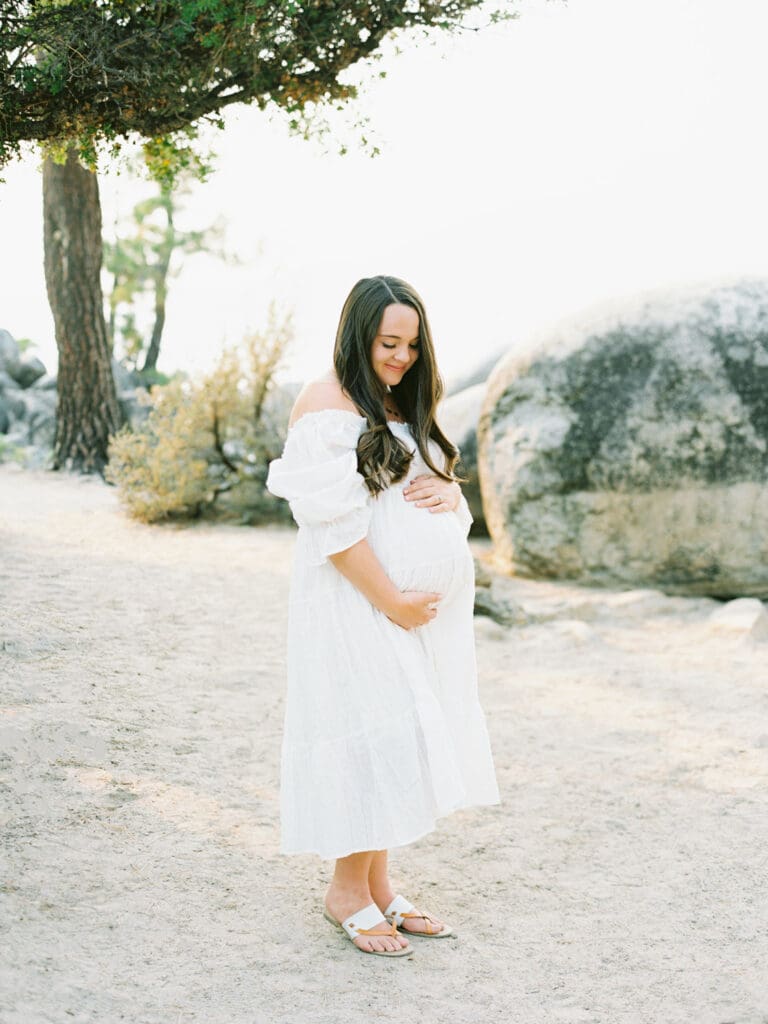 Maternity photography in Lake Tahoe, highlighting the elegance of an expecting mother against a breathtaking lakeside backdrop.