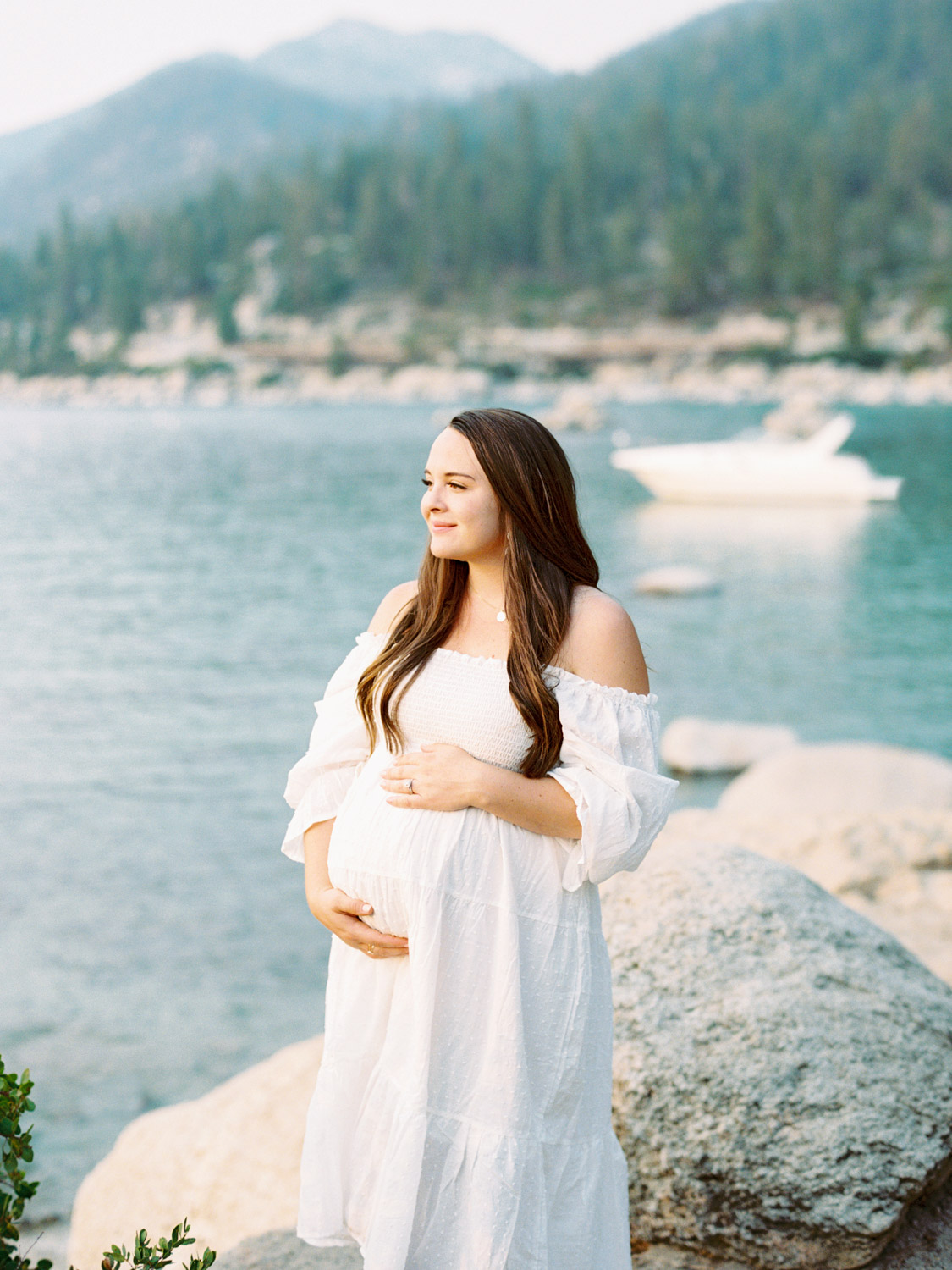 Maternity photography in Lake Tahoe, highlighting the elegance of an expecting mother against a breathtaking lakeside backdrop.