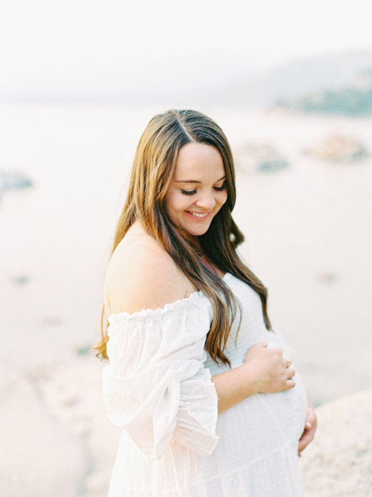 Maternity photography in Lake Tahoe, highlighting the elegance of an expecting mother against a breathtaking lakeside backdrop.