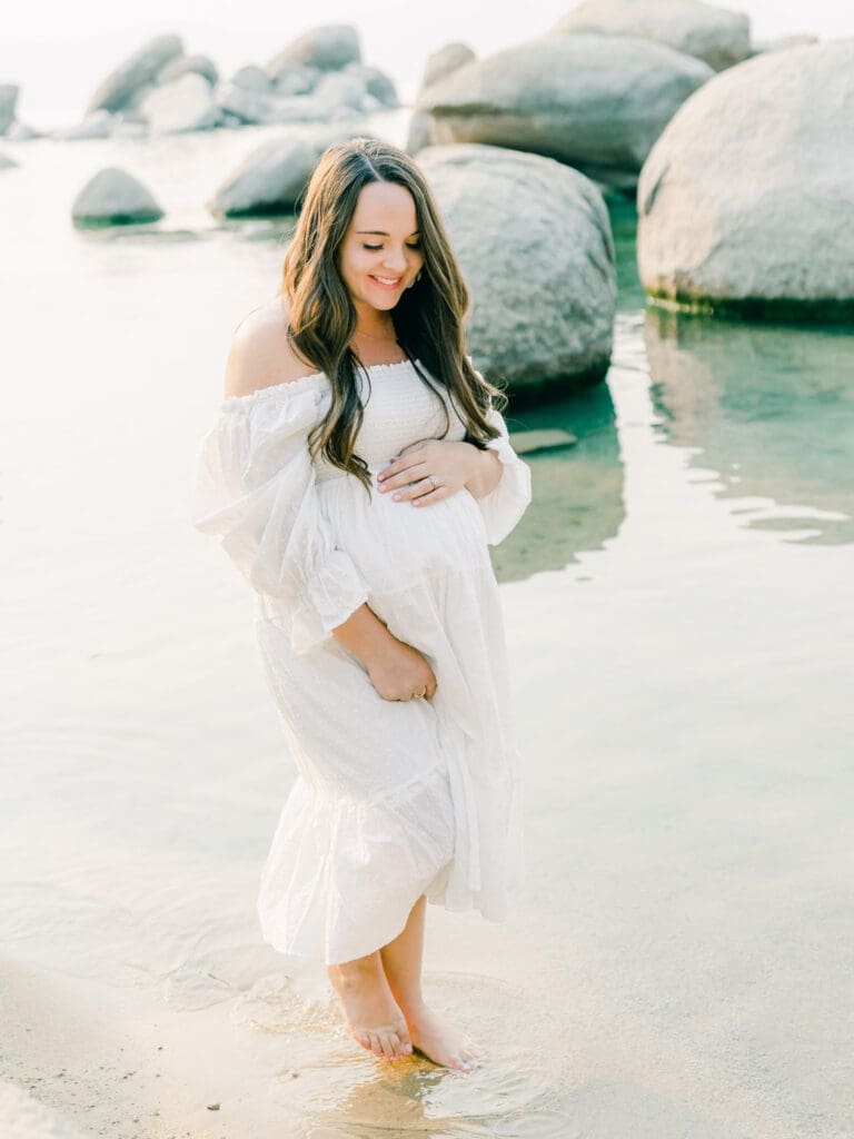 Maternity photography in Lake Tahoe, highlighting the elegance of an expecting mother against a breathtaking lakeside backdrop.