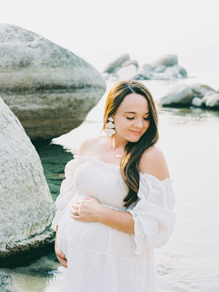 Maternity photography in Lake Tahoe, highlighting the elegance of an expecting mother against a breathtaking lakeside backdrop.