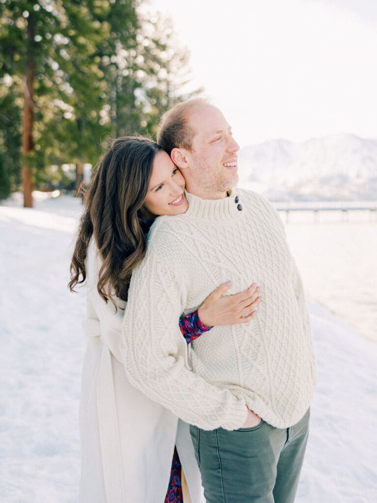 A photo of a couple cuddling during Lake Tahoe Winter Engagement Shoot