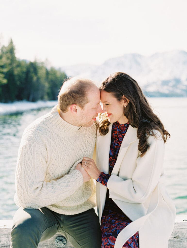 A photo of a Lake Tahoe Winter proposal at the beach by Film Engagement Photographer