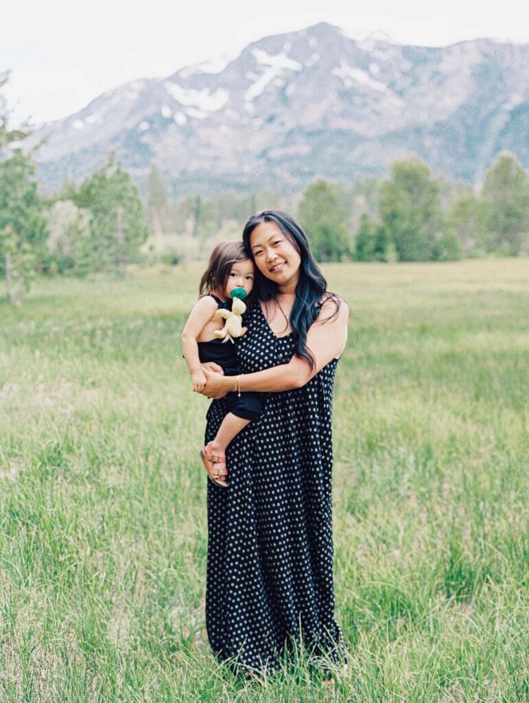 Mother and daughter family photo session in Tahoe meadow with mountain views by Lake Tahoe film family photographer 