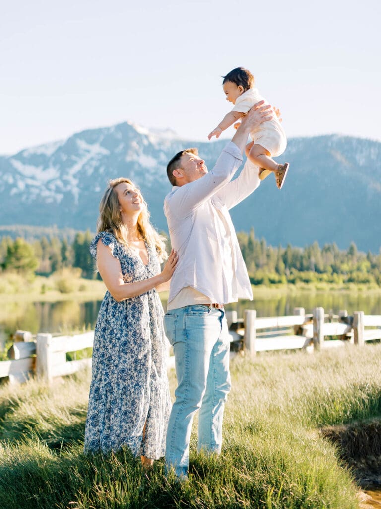 A family enjoying a photo session at Lake Tahoe, surrounded by picturesque landscapes and creating lasting memories.