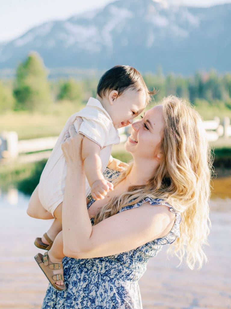 Scenic family photo session at Lake Tahoe, where a photographer captures the essence of mother and child bonds in nature.