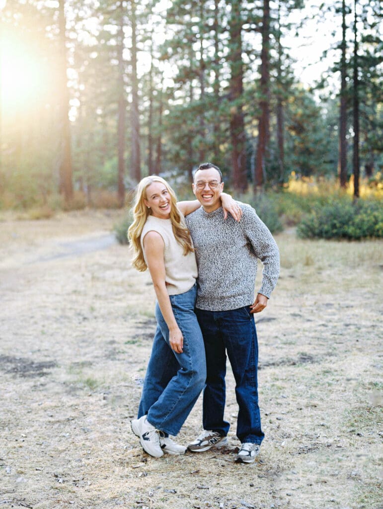 A couple embraces during a family photo session at Lake Tahoe, capturing a moment of love and connection.