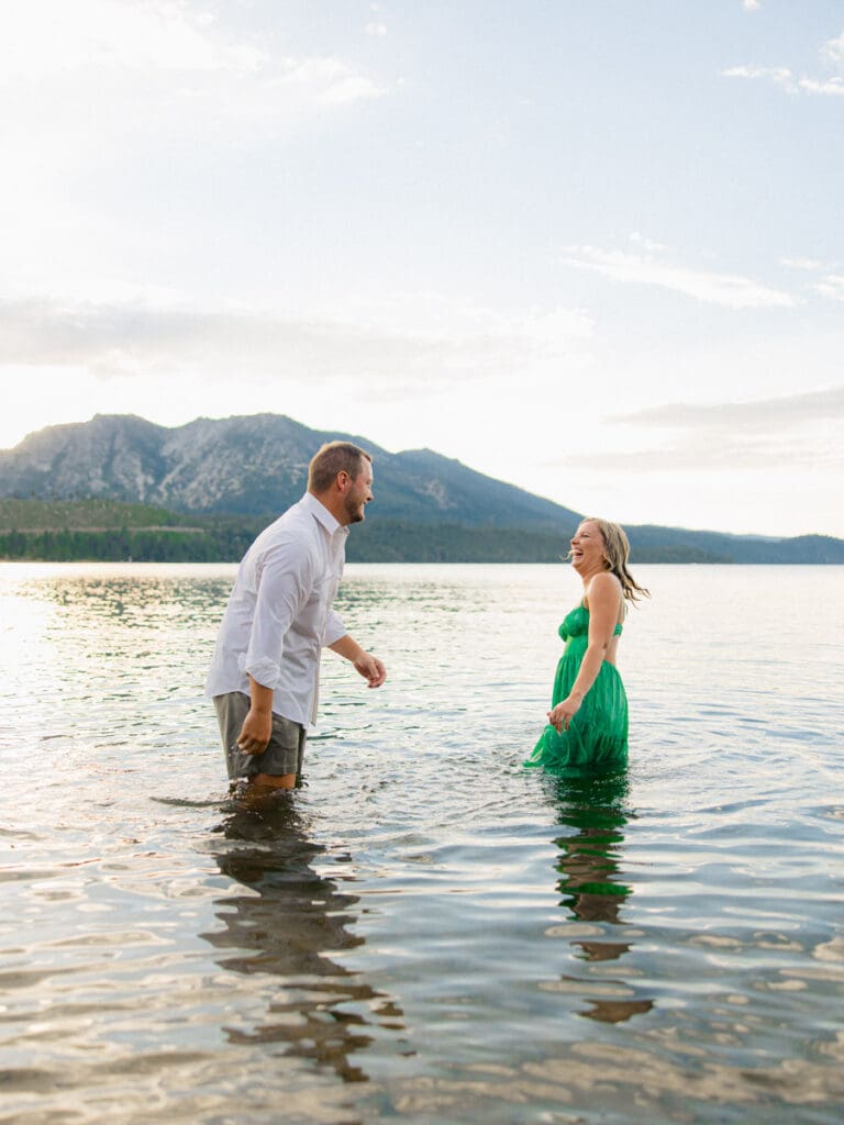 Romantic engagement photos at Lake Tahoe, featuring a stunning sunset and majestic mountains.