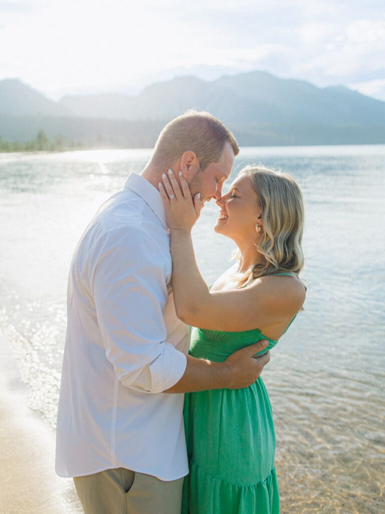 Captivating engagement photos at Lake Tahoe, with a breathtaking sunset and scenic mountain backdrop.