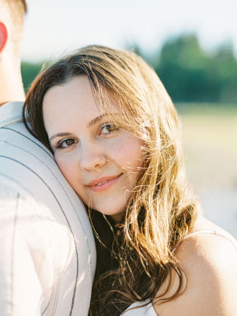 An engaged couple poses together at Lake Tahoe, capturing their love amidst the picturesque Tahoe nature landscape.