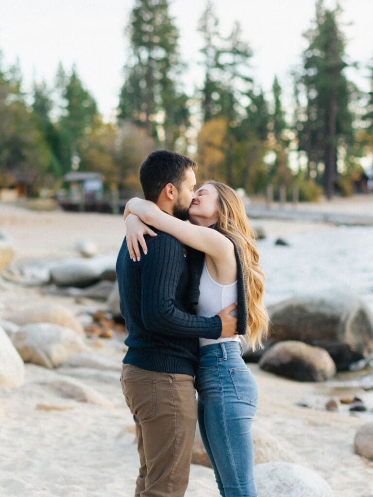 just engaged couple kissing on lake tahoe beach