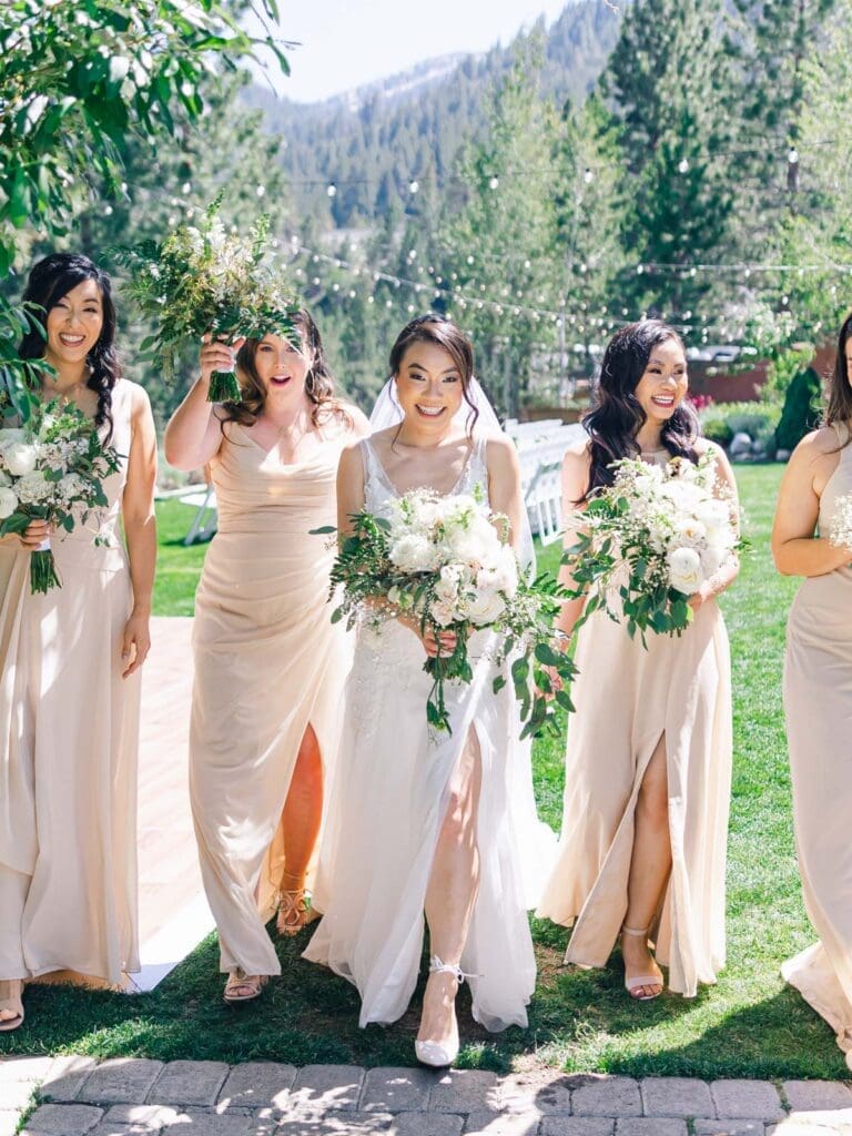 Bridesmaids pose for a wedding photo at Tannenbaum Lake Tahoe wedding venue, captured by the photographer.