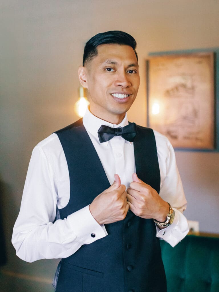 Groom pose for a photo at Tannenbaum Lake Tahoe wedding venue, captured by the photographer.