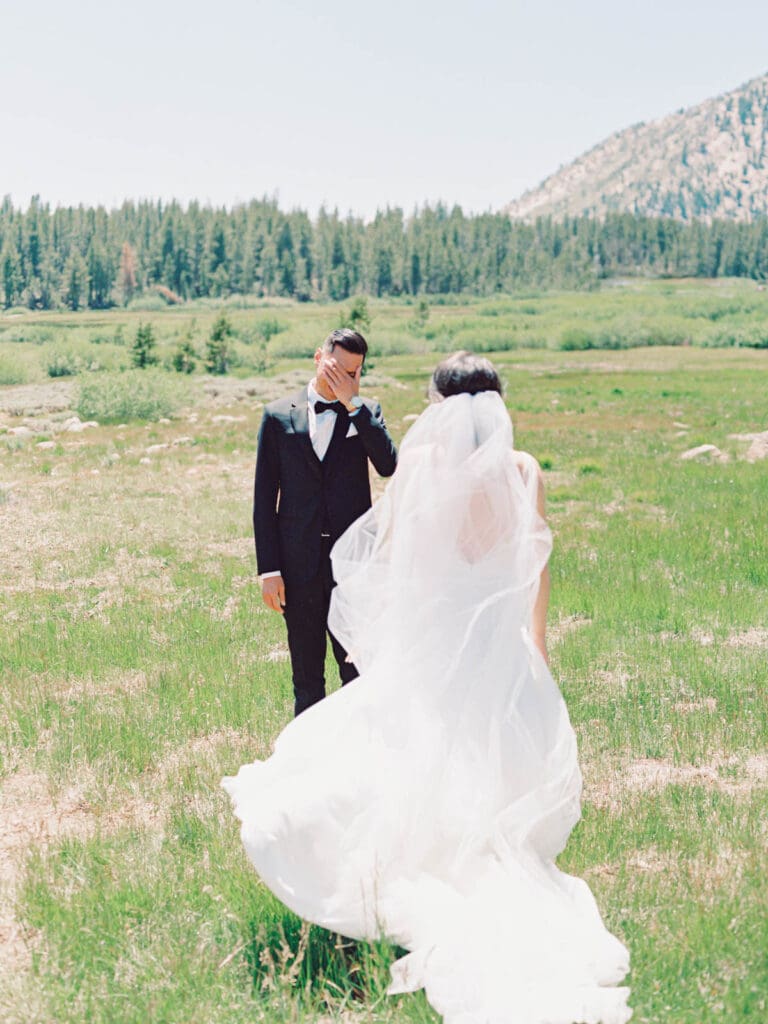 Bride and Groom First Look photo at Tannenbaum Lake Tahoe wedding venue, captured by the photographer.