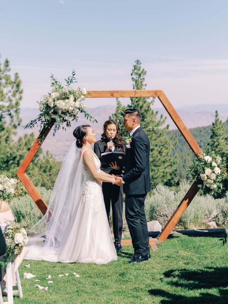 A beautiful wedding ceremony at Tannenbaum Lodge, set against the breathtaking backdrop of Lake Tahoe's mountains.