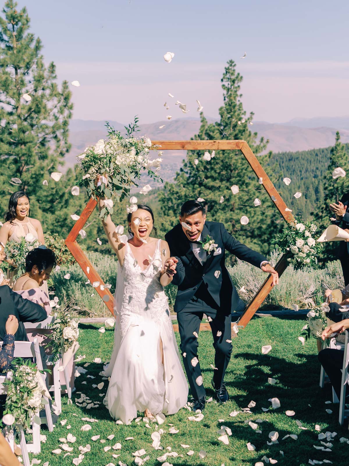 A beautiful wedding ceremony at Tannenbaum Lodge, set against the breathtaking backdrop of Lake Tahoe's mountains.