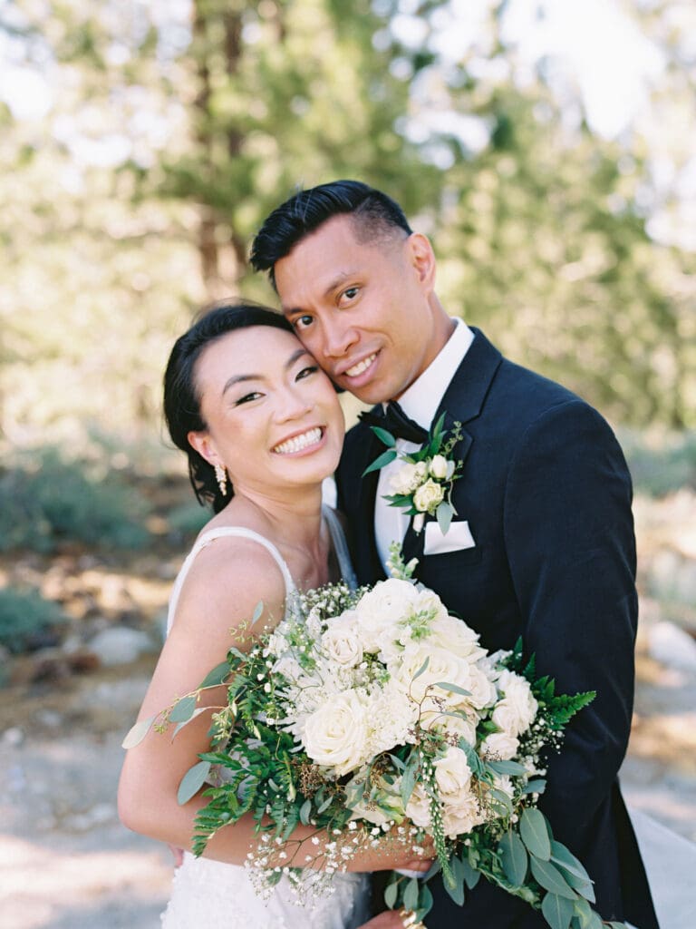 A bride and groom celebrate their wedding at Tannenbaum Lake Tahoe, beautifully photographed by a Tahoe wedding photographer.