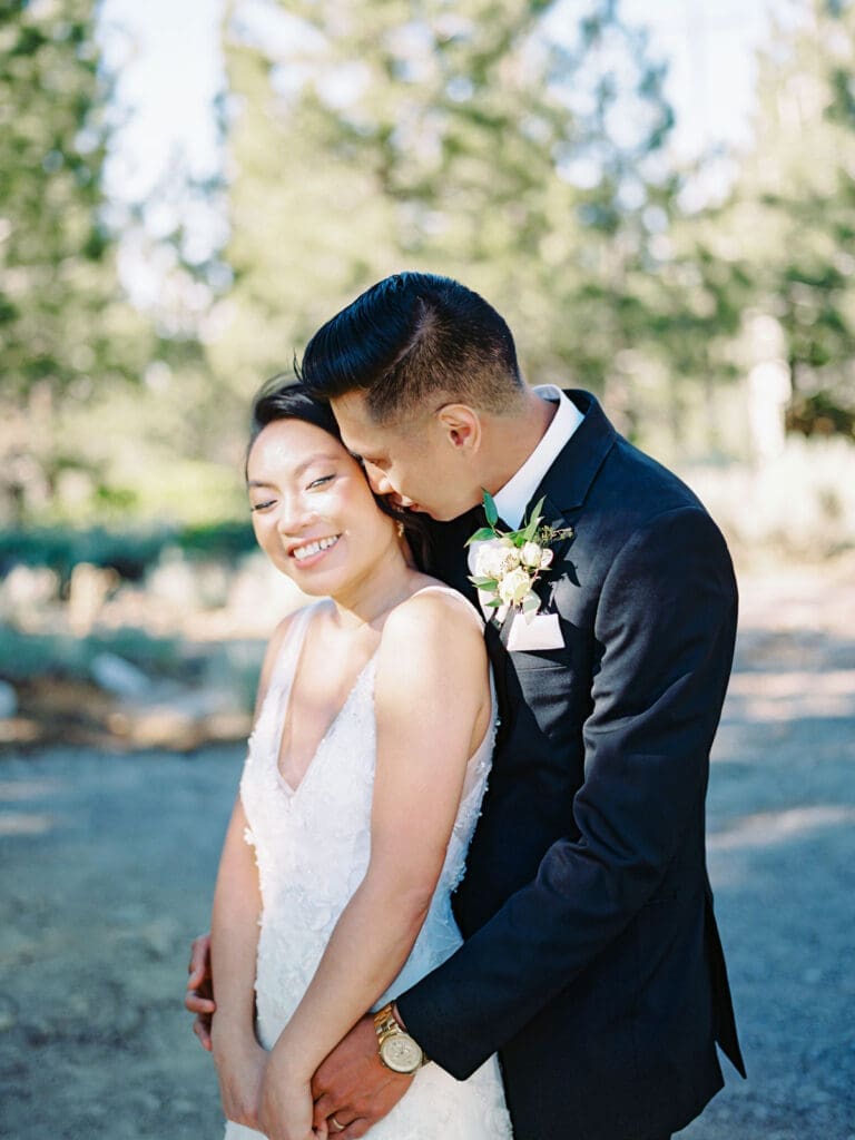 A bride and groom celebrate their wedding at Tannenbaum Lake Tahoe, beautifully photographed by a Tahoe wedding photographer.