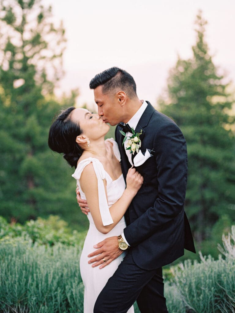 Bride and Groom kissing at Wedding reception at Tannenbaum Lake Tahoe