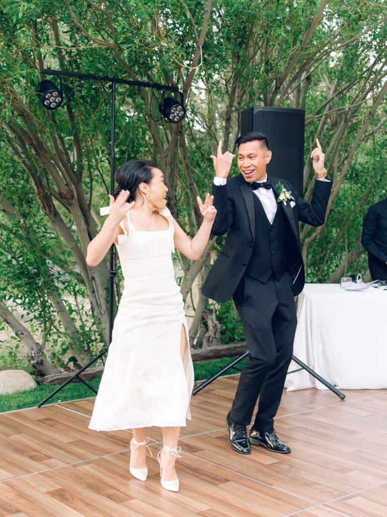 The bride and groom enjoy their first dance together at a scenic wedding reception at Tannenbaum Lake, Lake Tahoe.