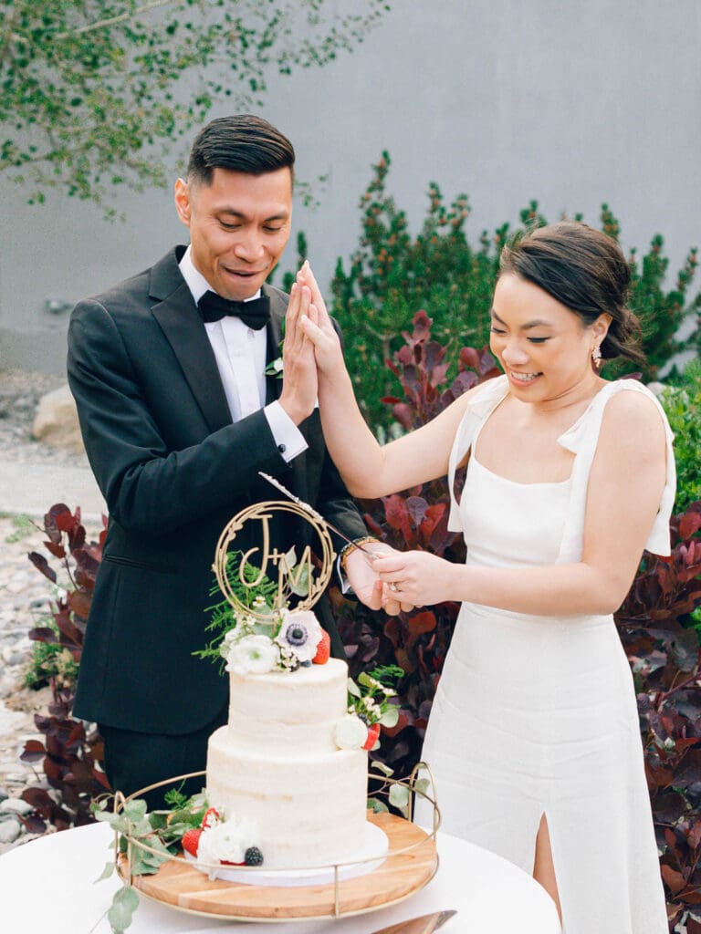 Bride and Groom cutting cake at Wedding reception at Tannenbaum Lake Tahoe