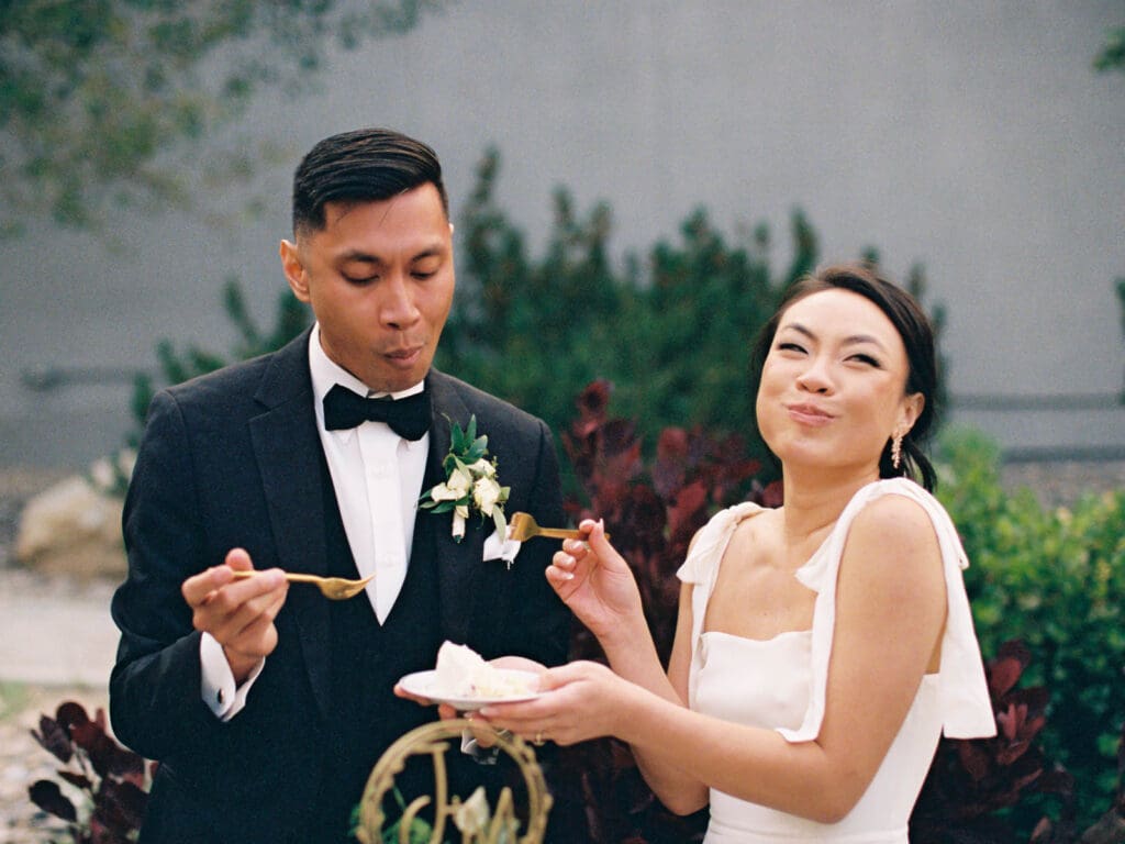 Bride and Groom eating cake at Wedding reception at Tannenbaum Lake Tahoe